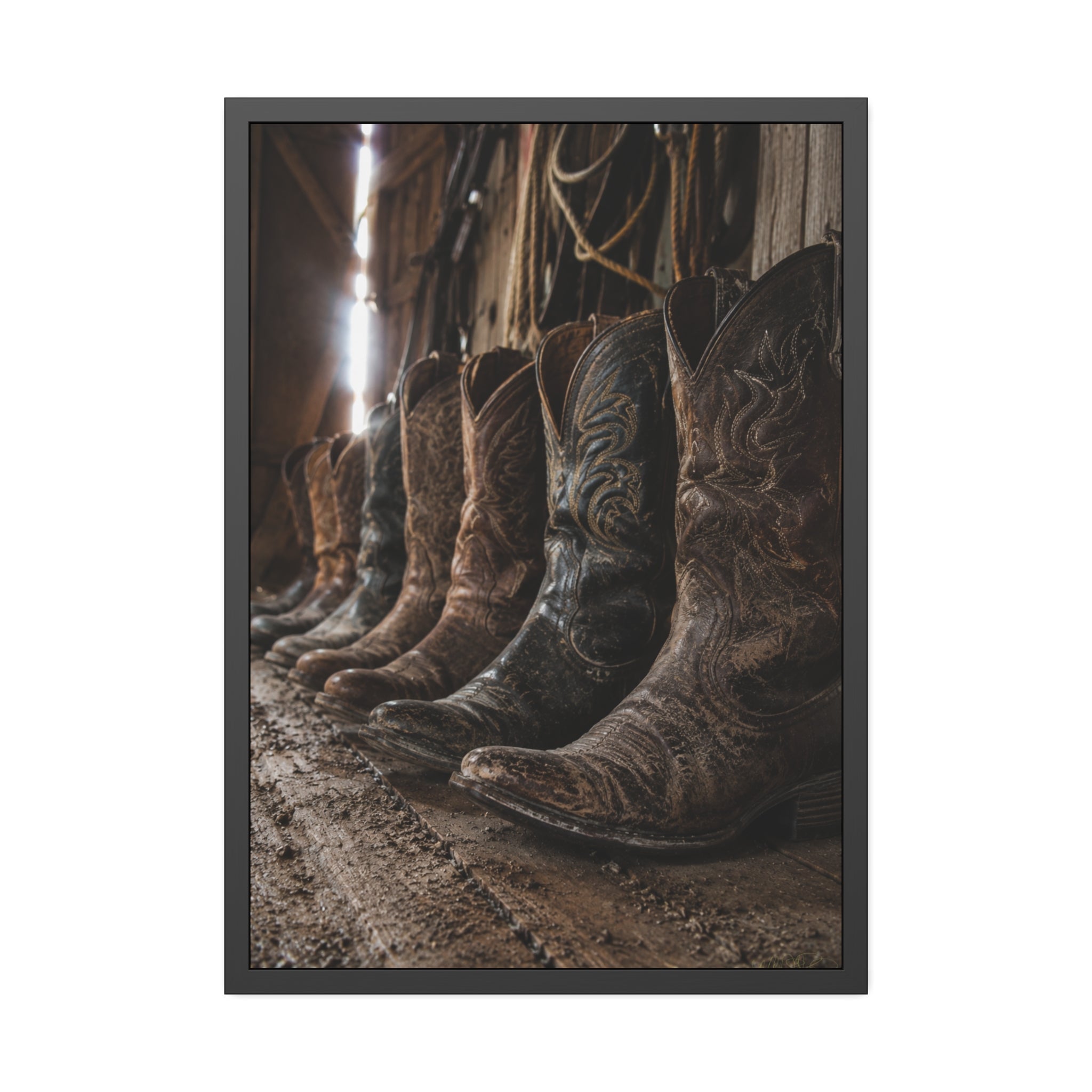 Weathered cowboy boots line the floor of an old barn, capturing the rugged beauty, heritage, and timeless spirit of Western ranch life.