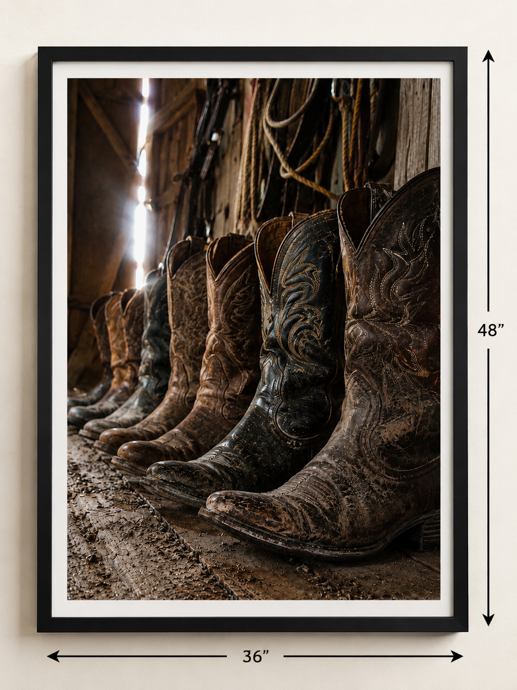 Weathered cowboy boots line the floor of an old barn, capturing the rugged beauty, heritage, and timeless spirit of Western ranch life.  Sizing parameters.