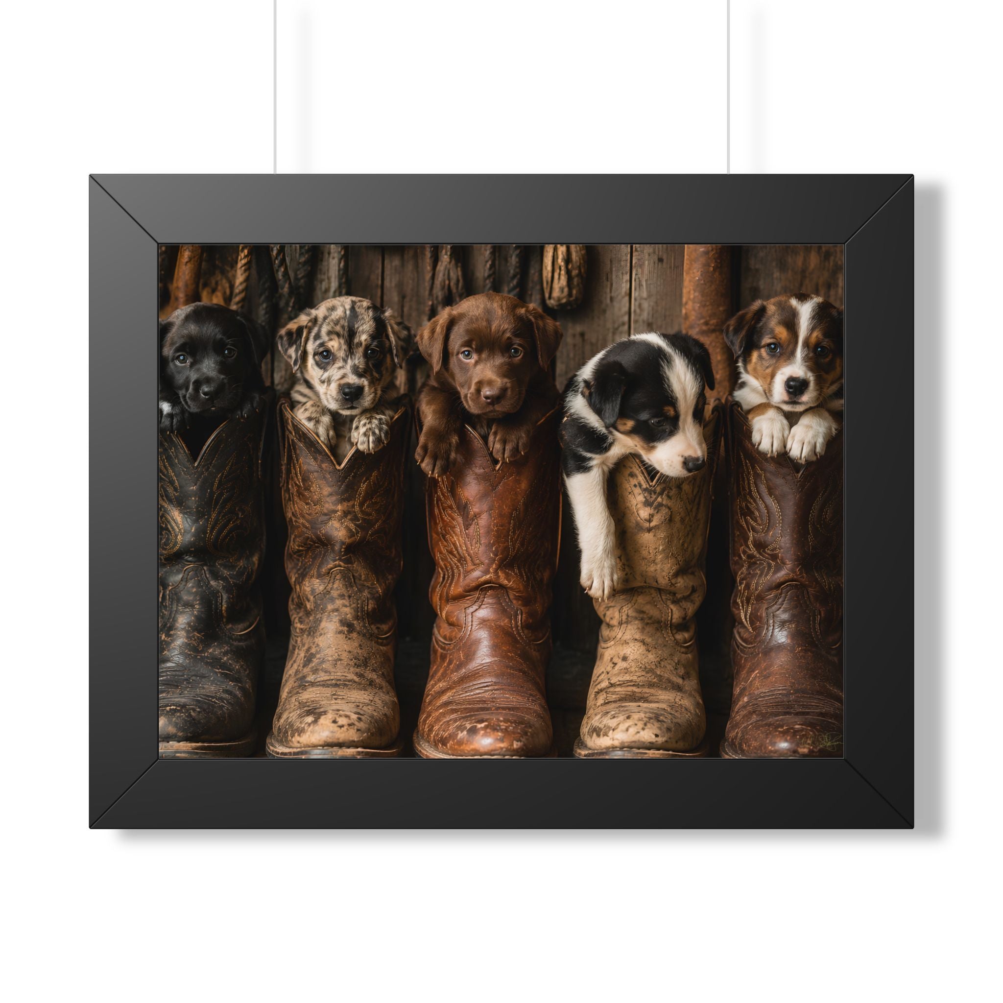 Black Frame Wall Portrait - Five adorable puppies nestled in weathered cowboy boots create a heartwarming scene filled with Western charm, playful personalities, and rustic country style.